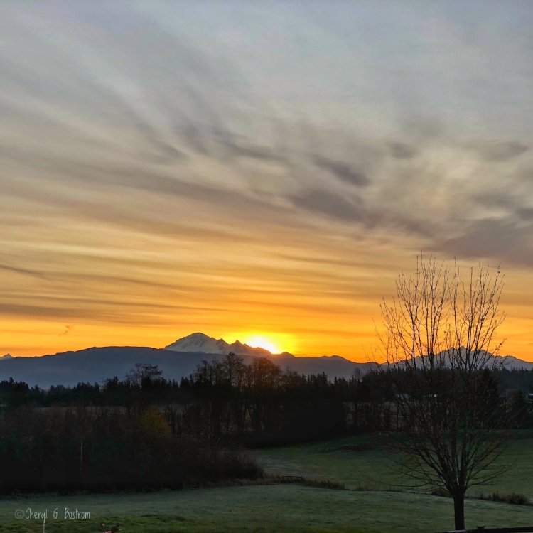 Sun rising to the south of Mt. Baker